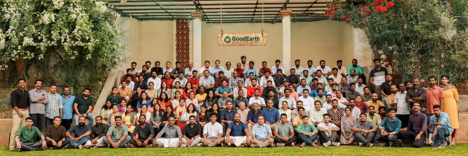 Team GoodEarth, gathered on the steps at the studio