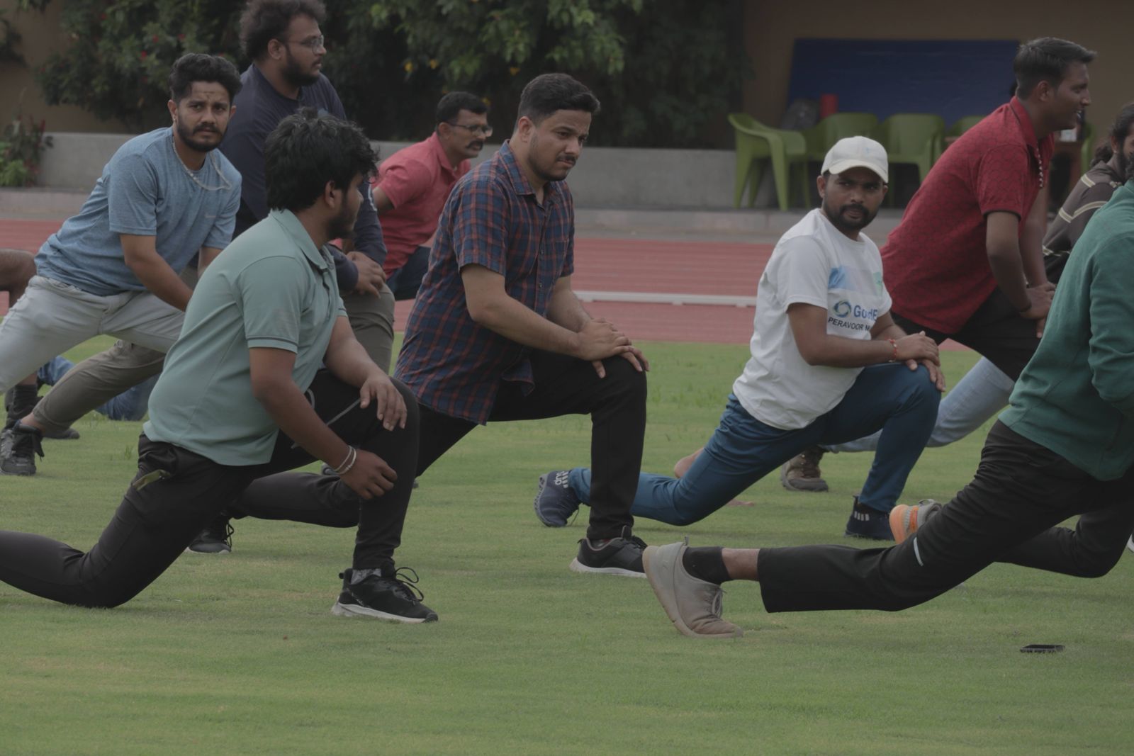 The team stretching together on a sports field